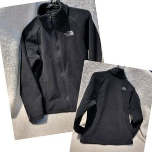 The North Face womens black zip jacket. Size Med. 4 pockets, cinch waist.